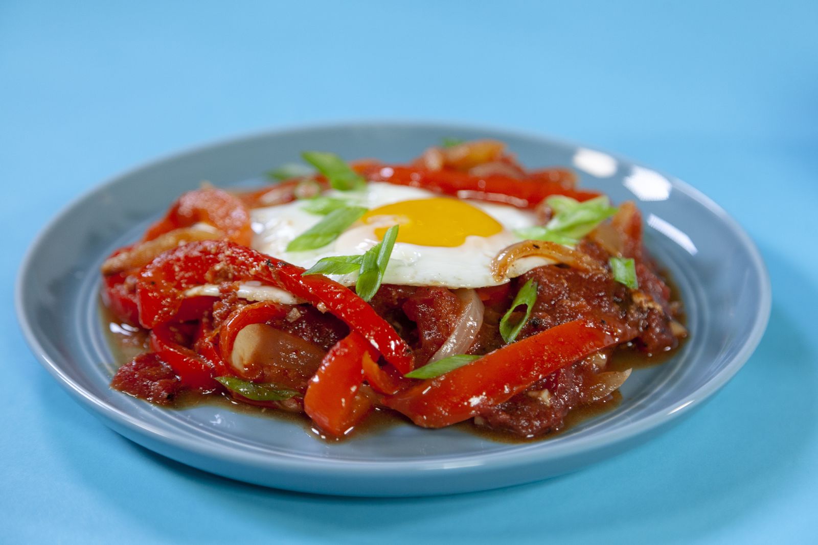 Shakshouka, a globally-inspired breakfast item, is a Tunisian/Israeli dish made of poached eggs, tomato sauce, onions, and chili peppers. Spiced with cumin, paprika, cayenne pepper and nutmeg, it is among 2019's food trends.
