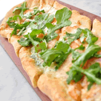 Tuscan Taster offering, Four Cheese Pizzetta. Gorgonzola Dolce, Mozzarella, Provolone, and Parmesan cheeses. Topped with fresh arugula and sliced tomatoes. Tuscan Taster offering, Four Cheese Pizzetta. Gorgonzola Dolce, Mozzarella, Provolone, and Parmesan cheeses. Topped with fresh arugula and sliced tomatoes.