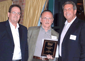 Don Lamb, President & Chief Operating Officer of E&I Holdings, Inc., Ron Marshall, Unsung Hero Award Winner, Bill Baumhauer, Chairman & Chief Executive Officer of E&I Holdings, Inc. Don Lamb, President & Chief Operating Officer of E&I Holdings, Inc., Ron Marshall, Unsung Hero Award Winner, Bill Baumhauer, Chairman & Chief Executive Officer of E&I Holdings, Inc.