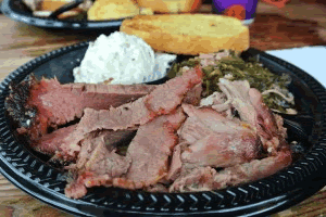 VooDoo BBQ & Grill's brisket, potato salad and Gris Gris greens. They make people feel good.