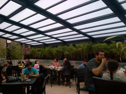 Have Your Wings and Eat Them Too, Under a Roll-A-Cover Retractable Enclosure - Buffalo Wild Wings Style!