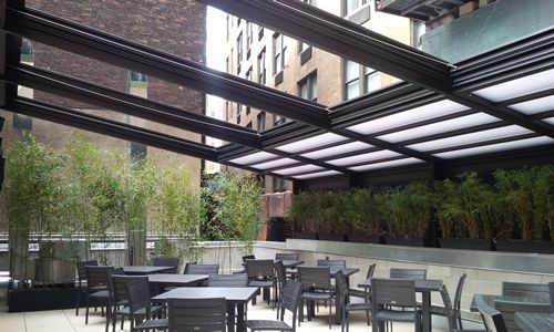 Have Your Wings and Eat Them Too, Under a Roll-A-Cover Retractable Enclosure - Buffalo Wild Wings Style!