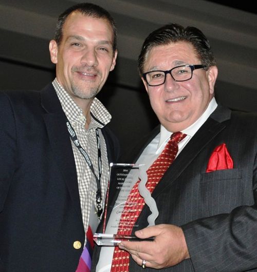 Outstanding General Manager of the Year, Stacey Ashley, with Tom Sacco, CEO and President, Homestyle Dining LLC.