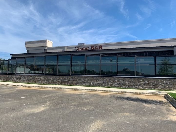 Cinder Bar's Roll-A-Cover Retractable Patio Enclosure Opening Soon